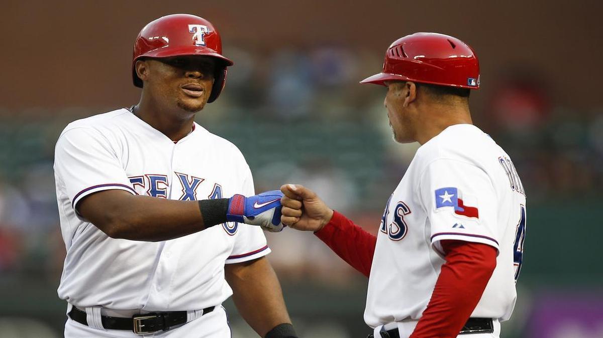 
Rangers third baseman Adrian Beltre, left, fist-bumps first base coach Hector Ortiz after his single against the Orioles in the second inning Saturday at Globe Life Park.
