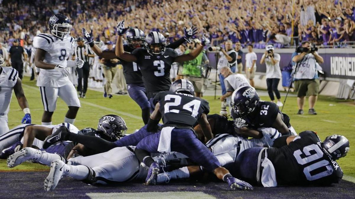 TCU safety Ridwan Issahaku takes an interception 53 yards for a touchdown in the second quarter against Jackson State at Among G. Carter Stadium Saturday night. The score gave the Horned Frogs a 28-0 lead.