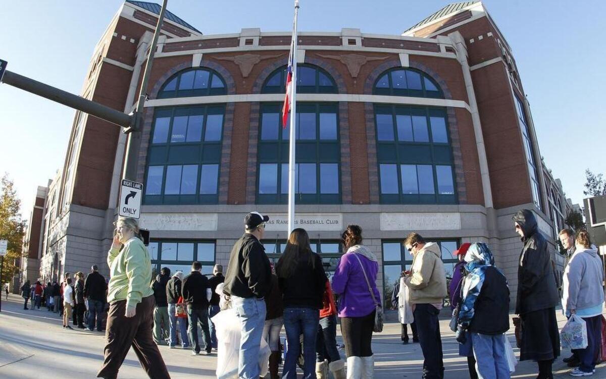 Rangers fans line up to attend the Rangers Cowboy Santas toy drive at the Ballpark in Arlington in 2012. Toy donations are encouraged at An Evening with the Rangers on Dec. 16 at Globe Life Park.