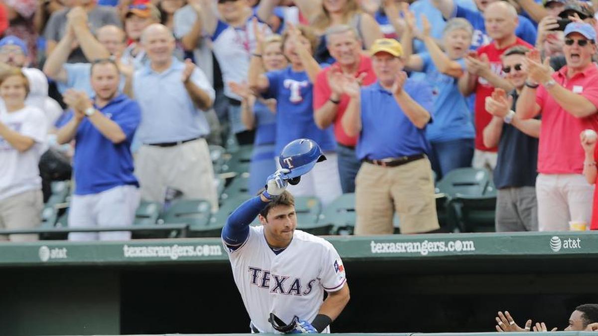 
Rangers rookie third baseman Joey Gallo tips his hat to the cheering crowd after hitting a two-run homer in the third inning as Texas beat the Chicago White Sox 15-2 on Tuesday at Globe Life Park.
