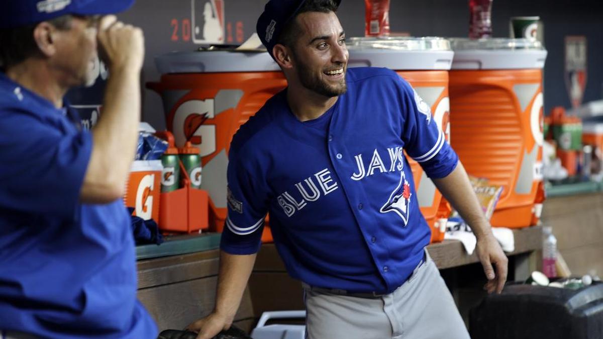 Toronto pitcher Marco Estrada, right, was all smiles after dominating the Rangers in Game 1.