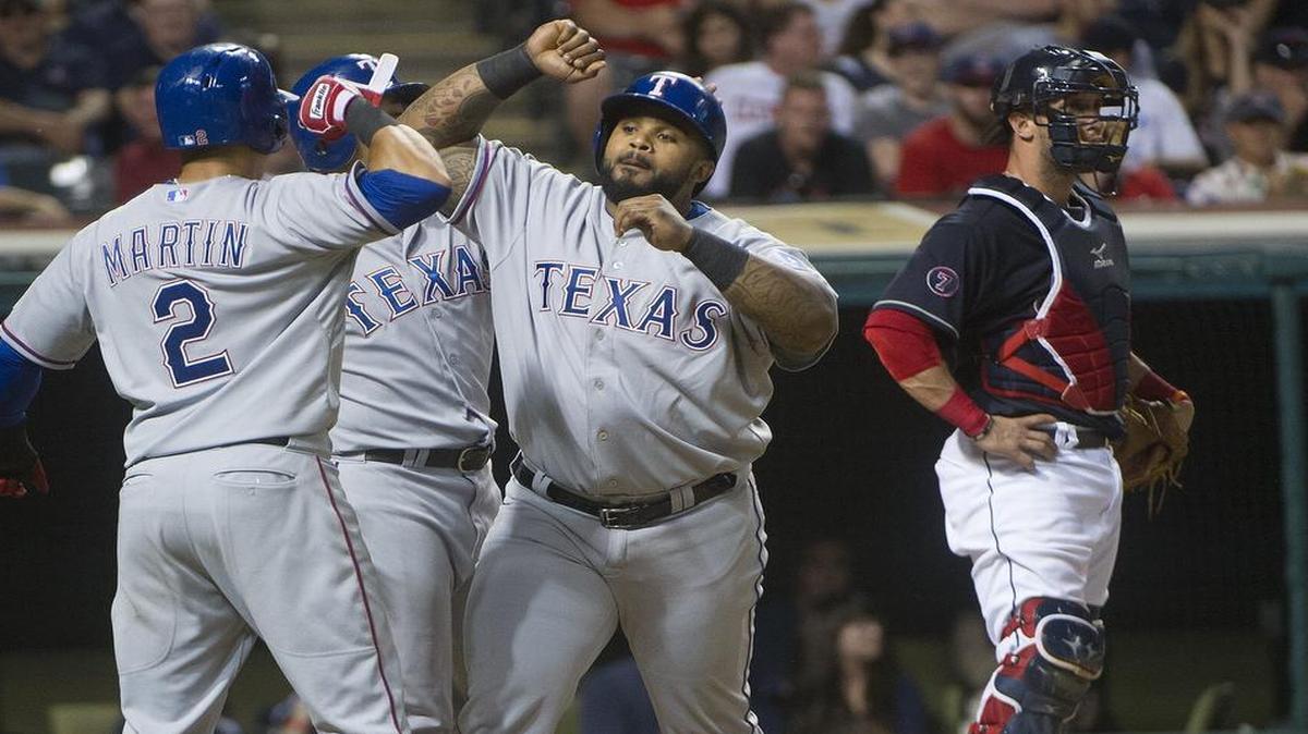 
Prince Fielder, right, is greeted by teammates Leonys Martin (2) and Shin-Soo Choo after his three-run home run in the fifth tied the game at 3-3 Tuesday night. Fielder had three more hits and is batting .371.


