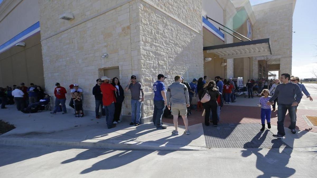 Rangers fans lined up for a winter caravan stop at an Academy store in Frisco in January 2014. Fans are encouraged to make sports equipment donations to the caravan stop in Garland on January 24.