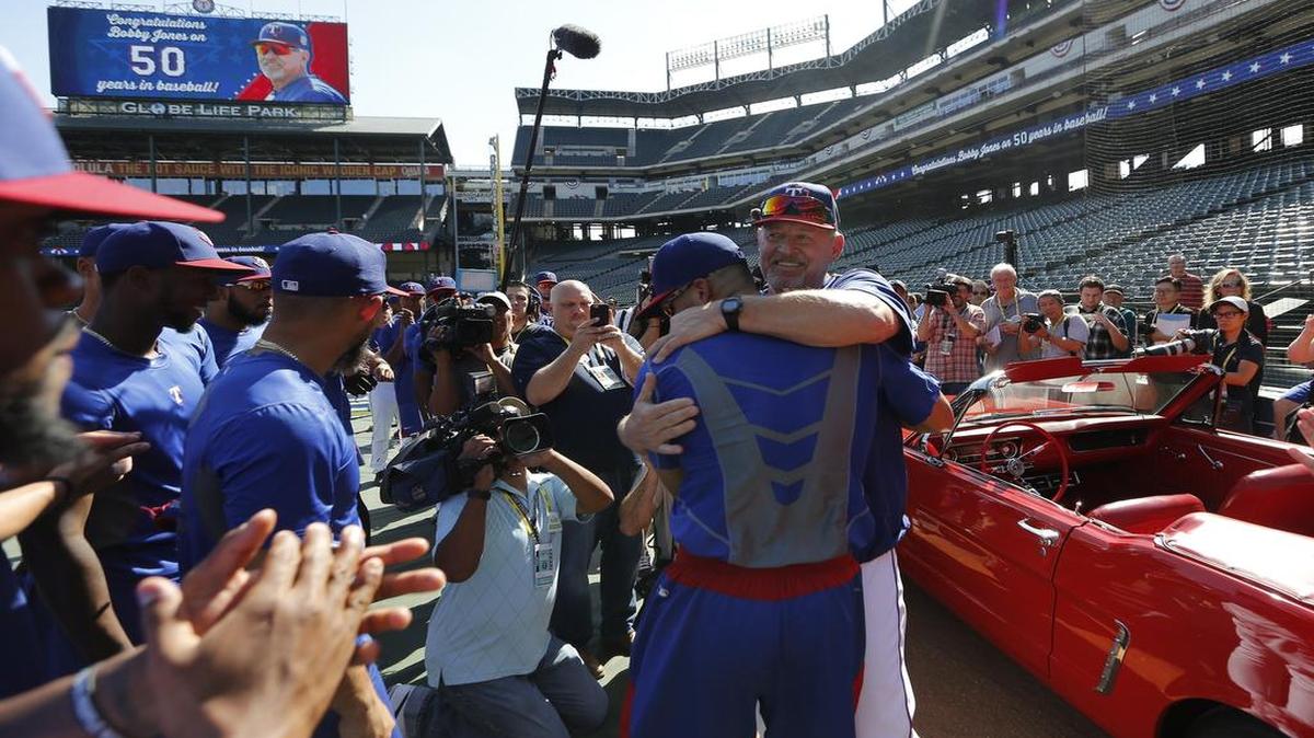 Ranger coach Bobby Jones, who retired after last season, was presented with a red Ford Mustang for his 50 years in baseball before a playoff game in October.