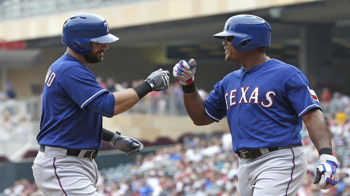 
Rangers’ Mitch Moreland, left, is congratulated by Adrian Beltre following his two-run home run off Twins pitcher Ervin Santana in the fourth Thursday. Moreland and Beltre combined for seven hits in Texas’ 6-5 win.
