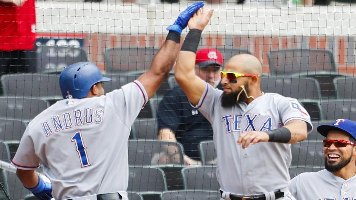 Elvis Andrus high-fives Rougned Odor after Andrus hit his 20th homer of the season in the first inning of Game 1 of a Wednesday doubleheader. Andrus added an RBI single in the third.