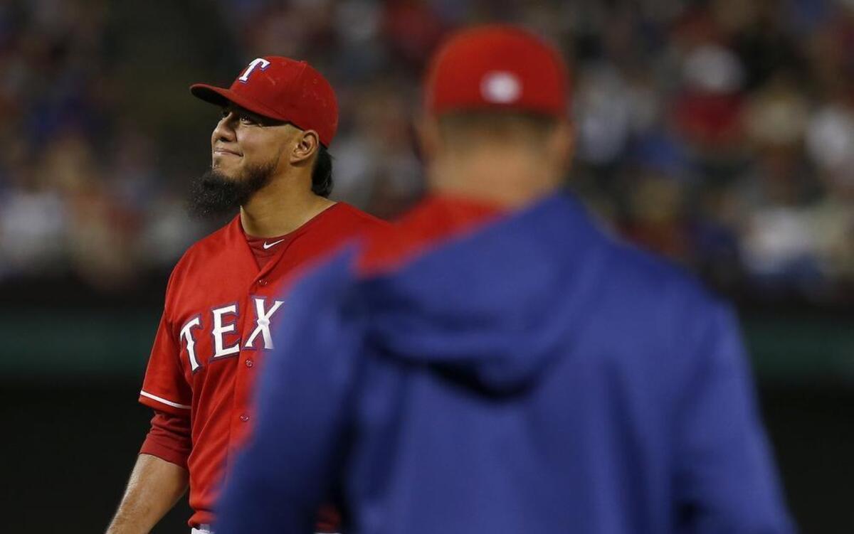 
Rangers starting pitcher Yovani Gallardo is pulled in the fifth inning by Texas Rangers manager Jeff Banister after giving up five runs on two homers against the Athletics Saturday night at Globe Life Park.
