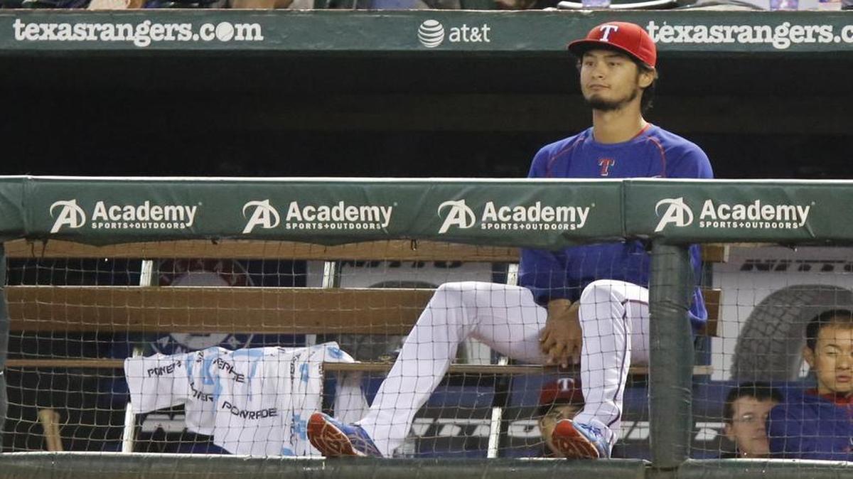 
Rangers pitcher Yu Darvish looks on from the dugout during a game in April. He’s recovering from March Tommy John surgery.
