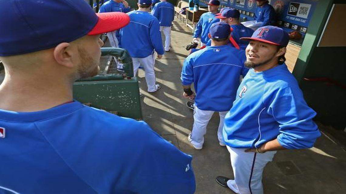
New Rangers pitcher Yovani Gallardo talks with teammate Jon Edwards during a workout Wednesday at Globe Life Park.
