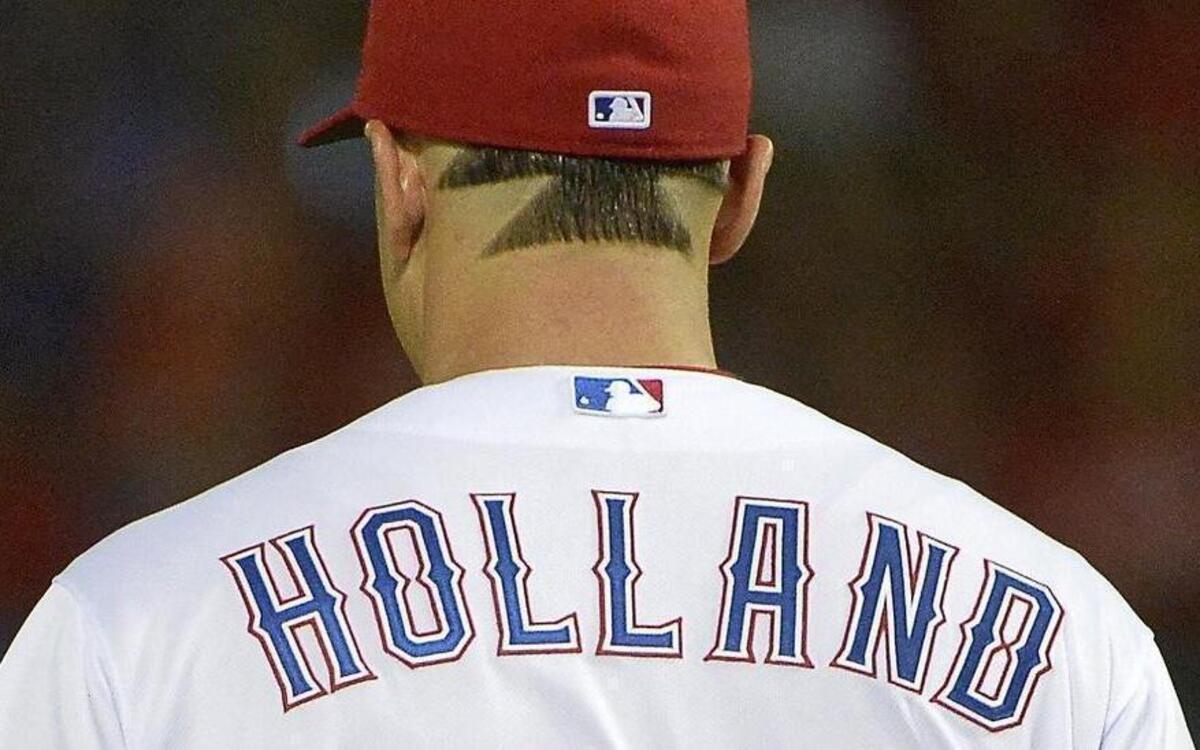 
Rangers starting pitcher Derek Holland’s Wild Thing haircut has been replaced by a  buzz cut. Holland was tired of hearing fans complain that his hair was affecting his performance.
