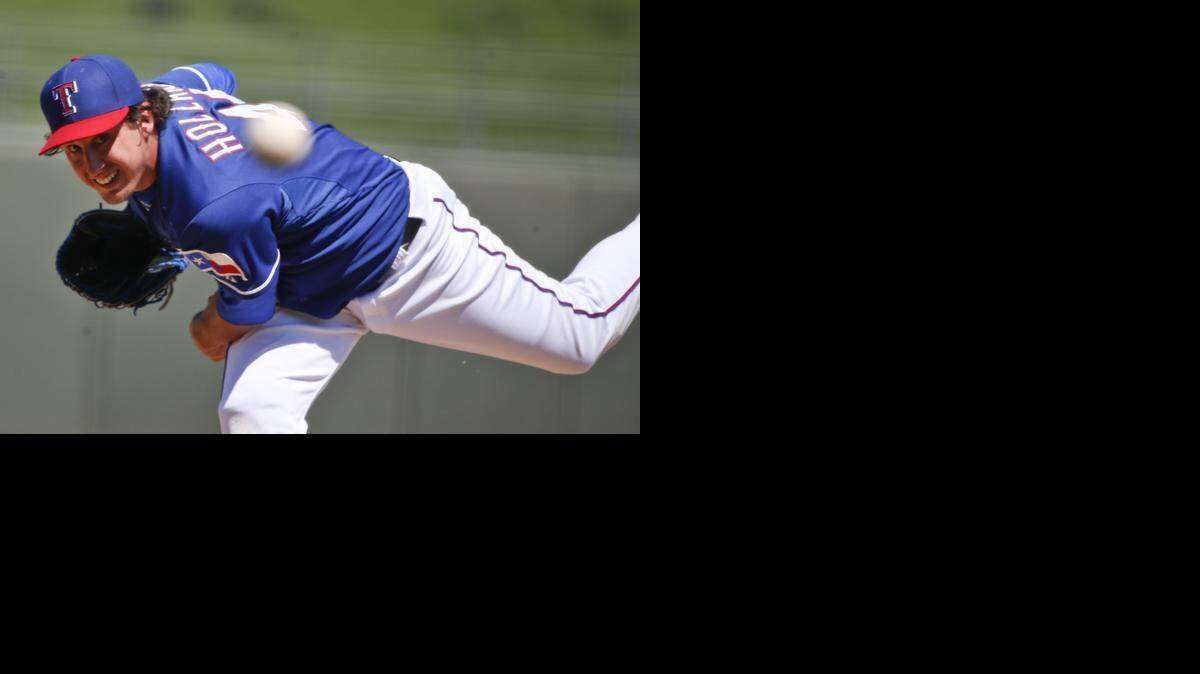 
Texas Rangers starting pitcher Derek Holland, shown earlier this spring, was doomed by a four-run fifth inning Tuesday against the Chicago Cubs in the Rangers’ 15-10 loss.



