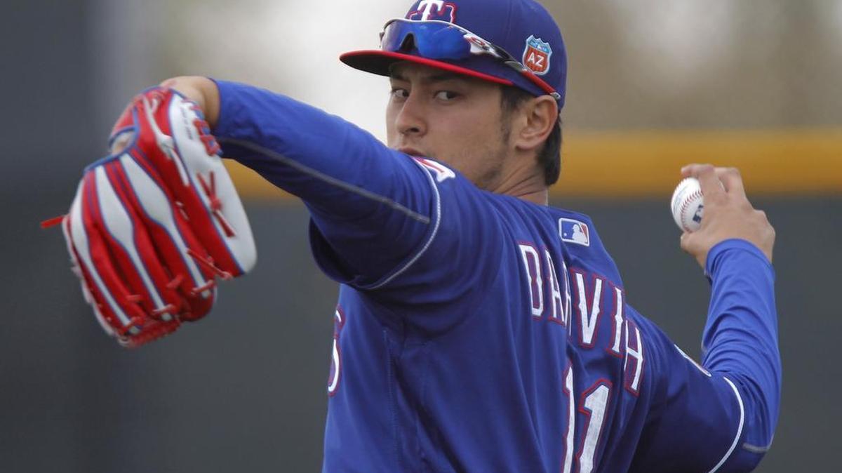 Yu Darvish threw off a flat mound Friday during the first spring workout for Texas Rangers pitchers and catchers. He also continued to turn over a new leaf with the media.