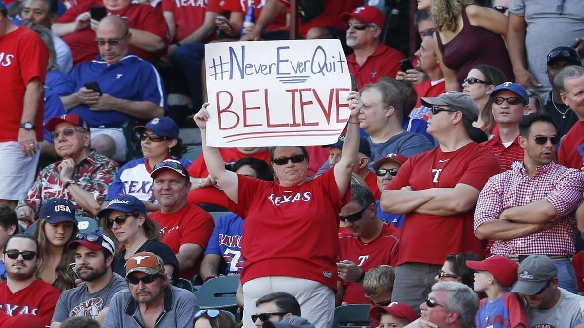 
Rangers fans celebrate during the team’s A.L. West clincher Sunday afternoon at Globe Life Park. Game 3 of the ALDS in Arlington is almost sold out.
