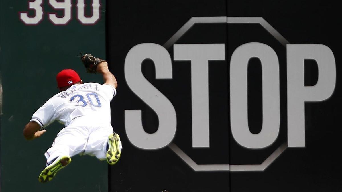 
Rangers’ left fielder Will Venable catches a fly ball by the Blue Jays’ Ryan Goins in the second inning Thursday at Globe Life Park. Texas held on to win the series finale 4-1 and halt Toronto’s five-game win streak.
