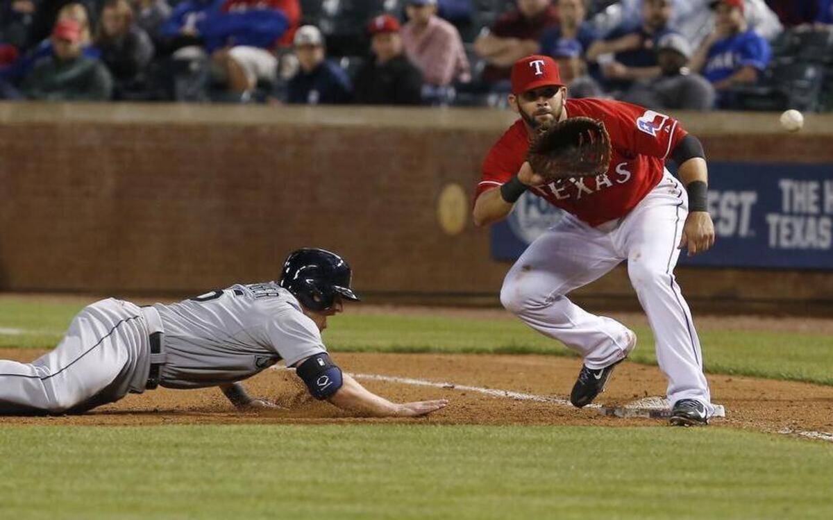 
Rangers first baseman Mitch Moreland, right, in action Monday, was out of the lineup Tuesday after his left elbow locked up.


