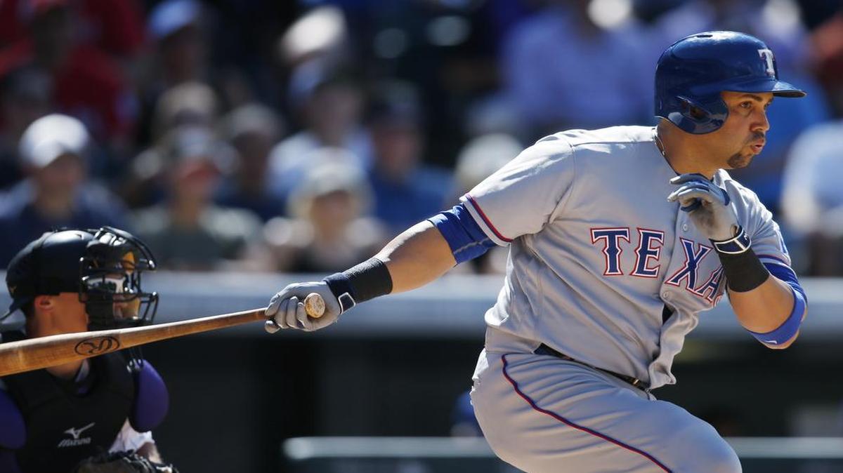 Carlos Beltran connects for a run-scoring single in the eighth inning Tuesday against the Rockies. Beltran returned to the Rangers lineup after missing two games with a bruised left quadriceps, going 1 for 4 with an RBI.