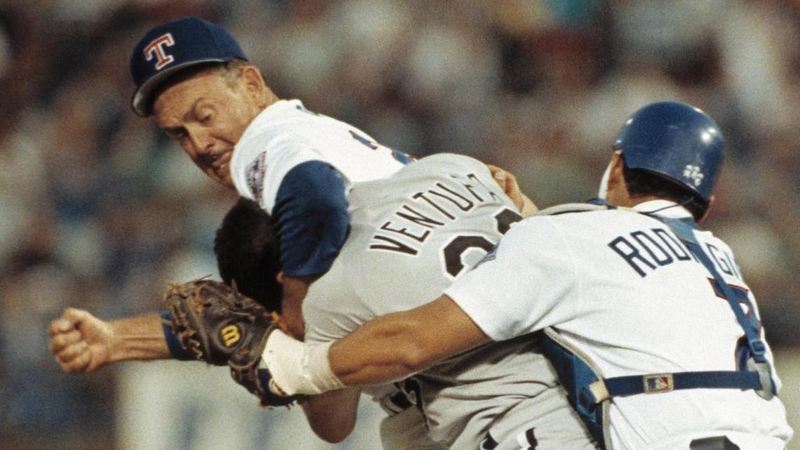 Texas Rangers pitcher Nolan Ryan, left, hits Robin Ventura of the Chicago White Sox after Ventura charged the mound in Arlington, Texas, on August 4, 1993.