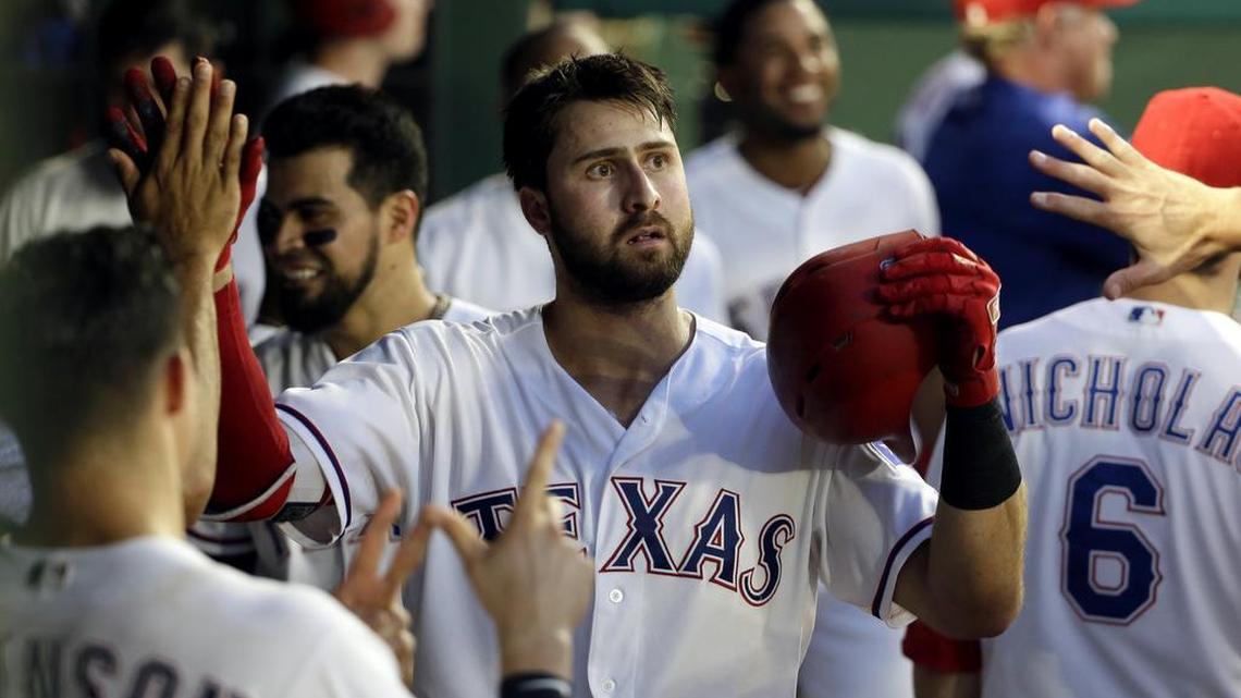 Texas Rangers slugger Joey Gallo, center, shown after hitting a home run Monday, left Sunday’s game after a collision on an infield pop-up.