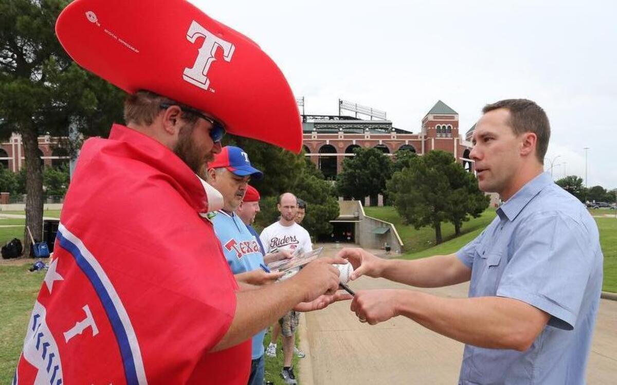 
Michael Kahlig of Arlington gets a autograph from former Texas Ranger David Murphy, who now plays for the Cleveland Indians, at near the players’ enterance at Globe Life Park. 
