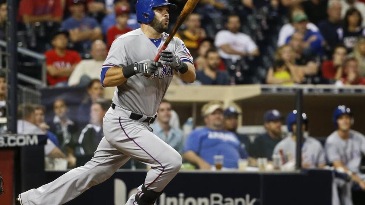 
Mitch Moreland watches his game-winning double down the right field line in the 10th inning of Wednesday’s game in San Diego. Texas won 4-3.


