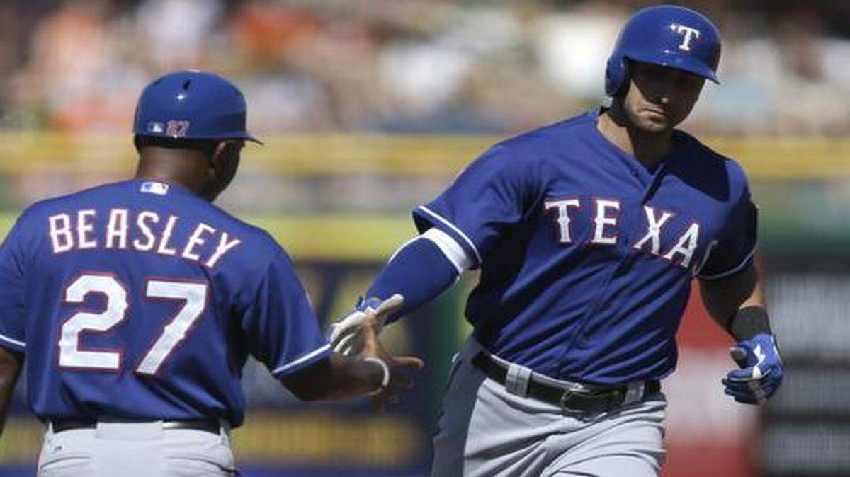 
The Rangers’ Joey Gallo is congratulated after his three-run homer off Giants’ pitcher Jake Peavy, which scored the game’s only runs Friday in Scottsdale, Ariz.



