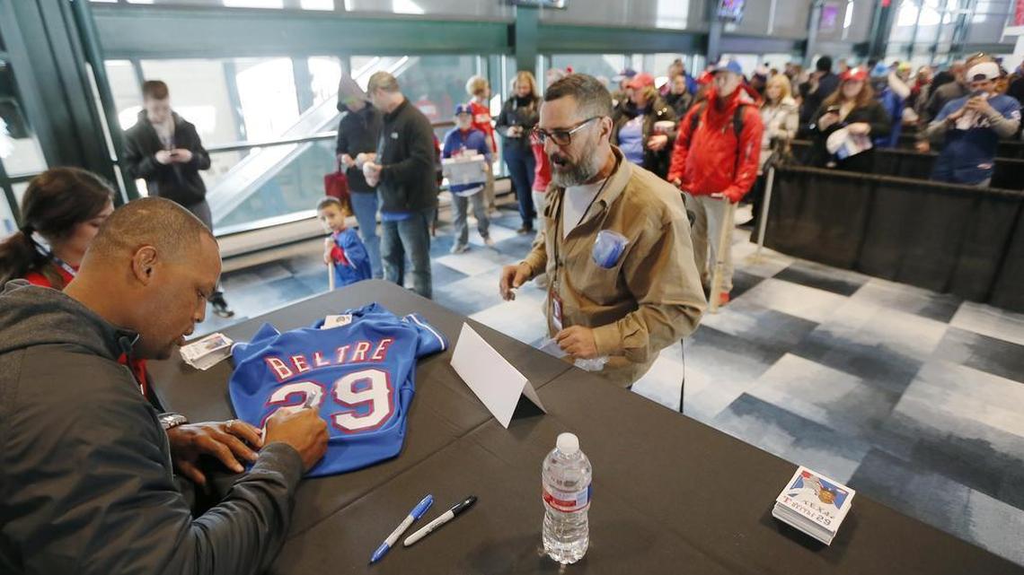 Texas Rangers’ Adrian Beltre autographs a jersey for Don Vess during the Rangers Fan Fest in Arlington in January 2016.