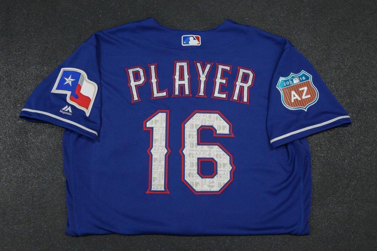 The Rangers spring training uniform from Majestic includes a highway-like road sign with the Texas abbreviation on one sleeve.
