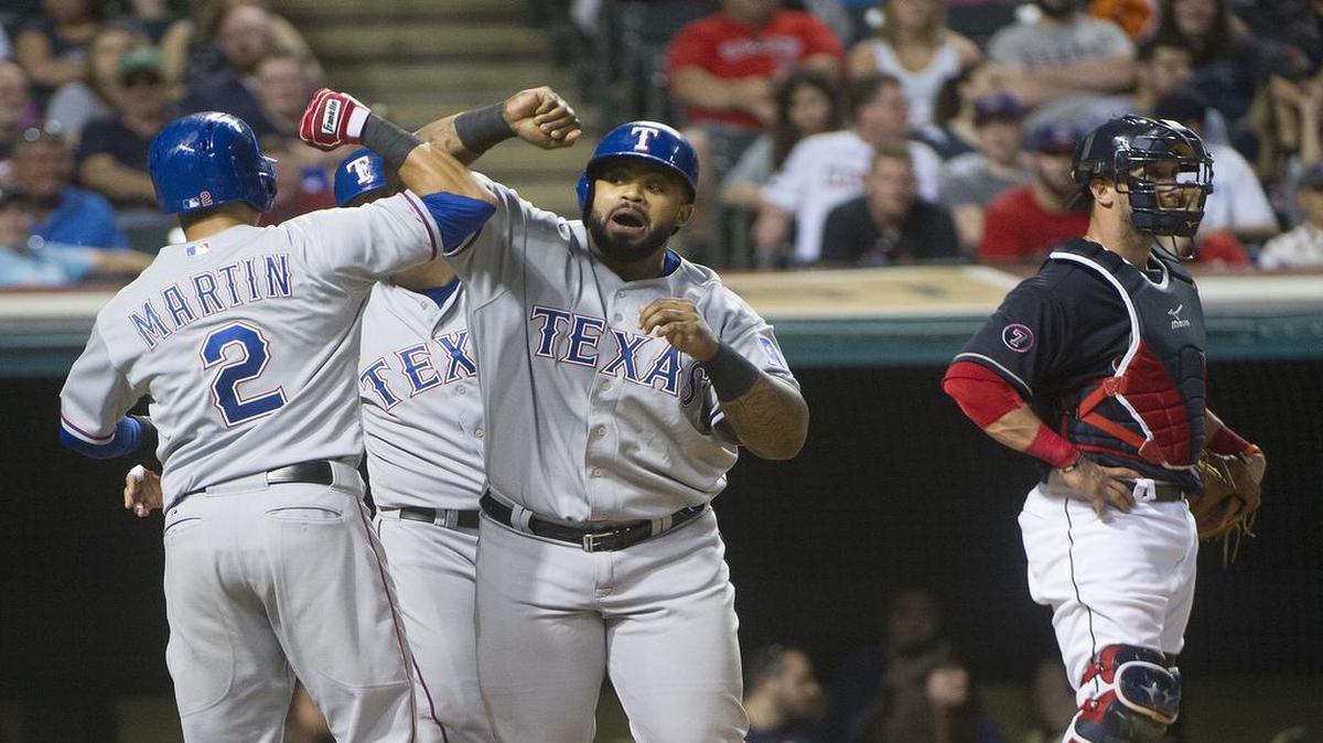 
Rangers’ slugger Prince Fielder is greeted at home plate by Lenoys Martin (2) and Shin-Soo Choo, after hitting a three-run home run off Cleveland Indians’ starter Danny Salazar in the fifth inning Tuesday.

