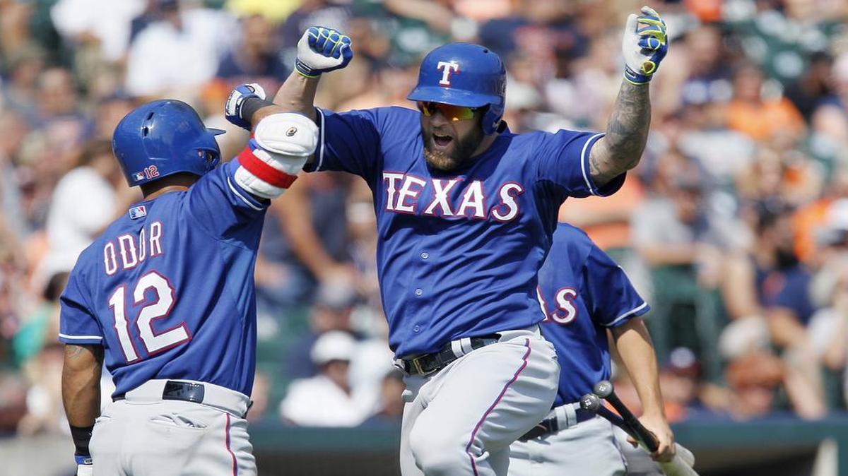 
Mike Napoli, right, celebrates with Rougned Odor after belting a home run for the Rangers in the eighth inning.


