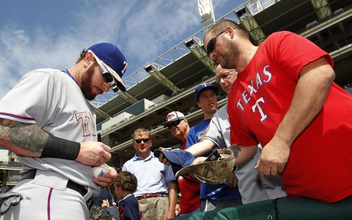 
Rangers outfielder Josh Hamilton signs an autograph Monday before his 2015 debut with the Rangers.


