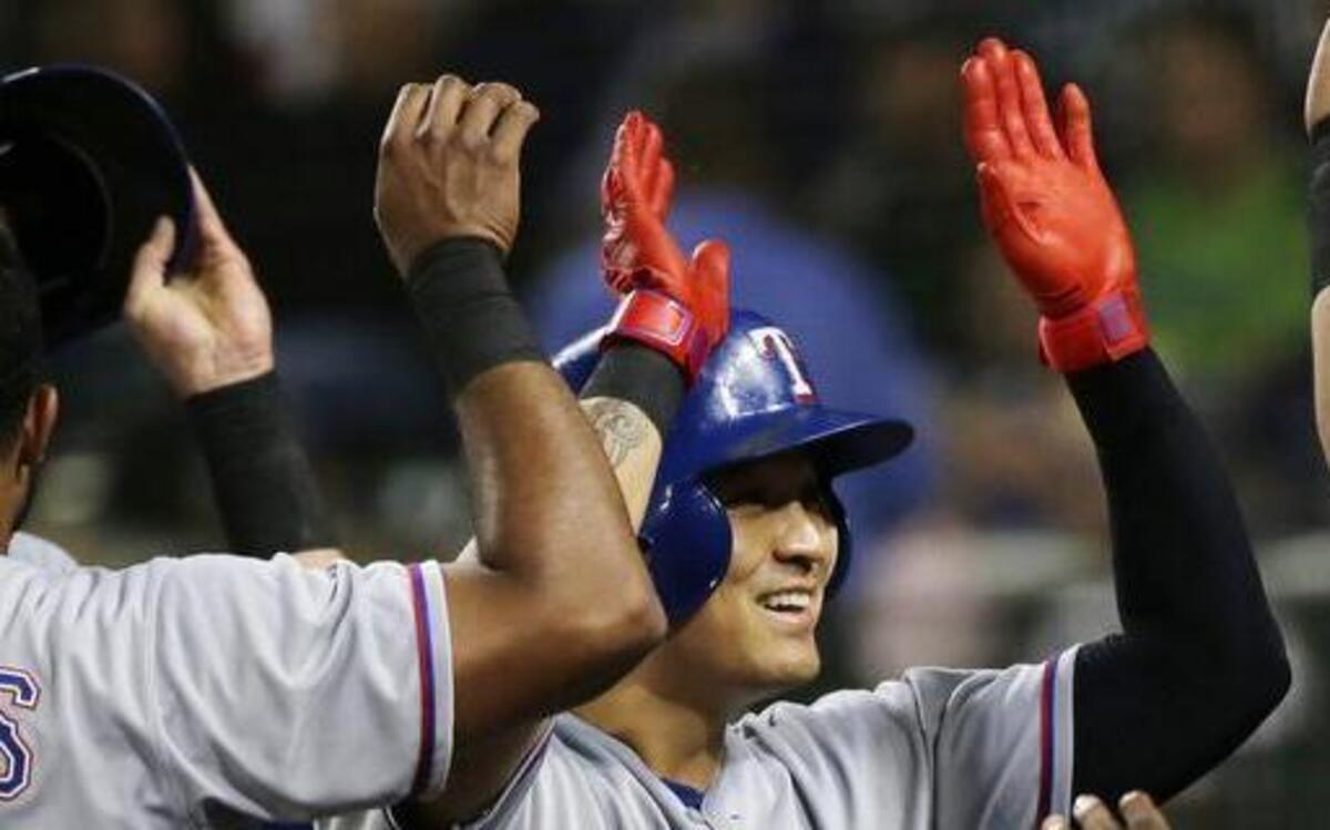 
Shin-Soo Choo, center, was all smiles Tuesday after htting a three-run homer in the third inning.
