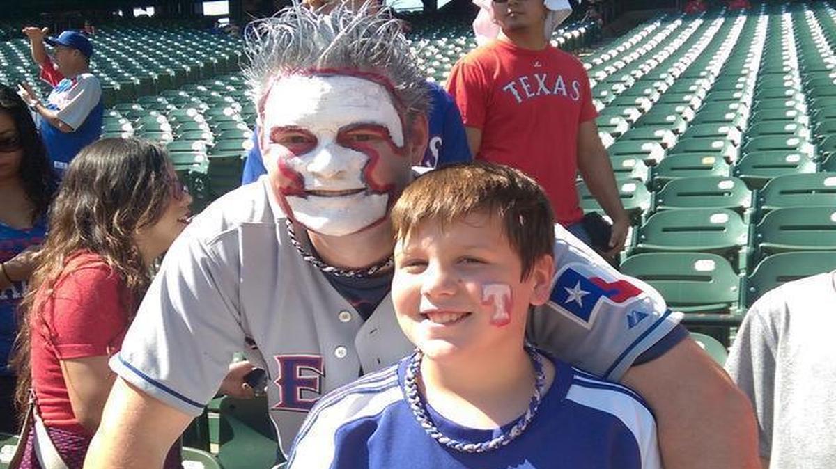 
William De La Paza, 34, and son Micah De La Paza, 10, of Arlington, showed their support of the Rangers with face paint.

