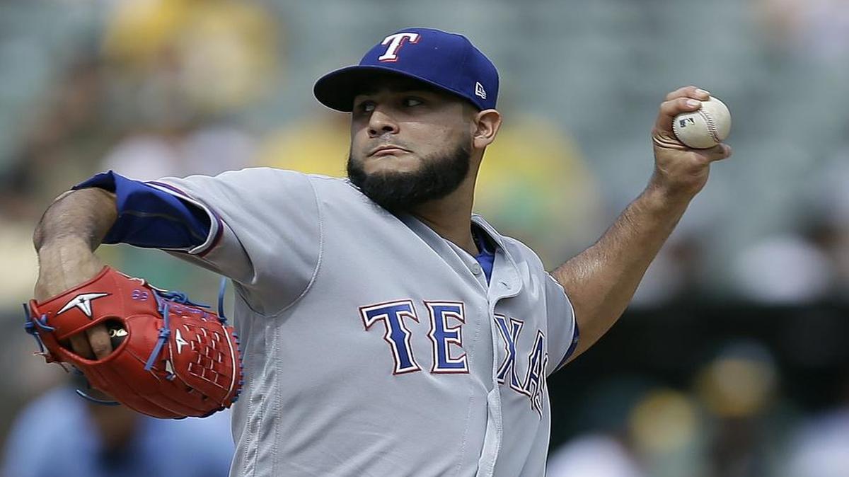 Martin Perez struggled with his command early but kept Oakland off the scoreboard until a five-run fifth inning.