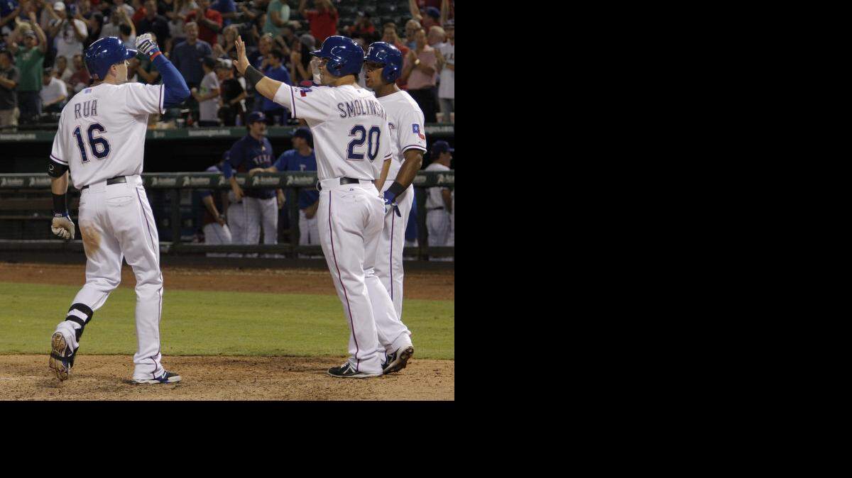 
Rangers outfielders Ryan Rua, left, and Jake Smolinski, along with Michael Choice, will compete for the left field job in the spring. 
