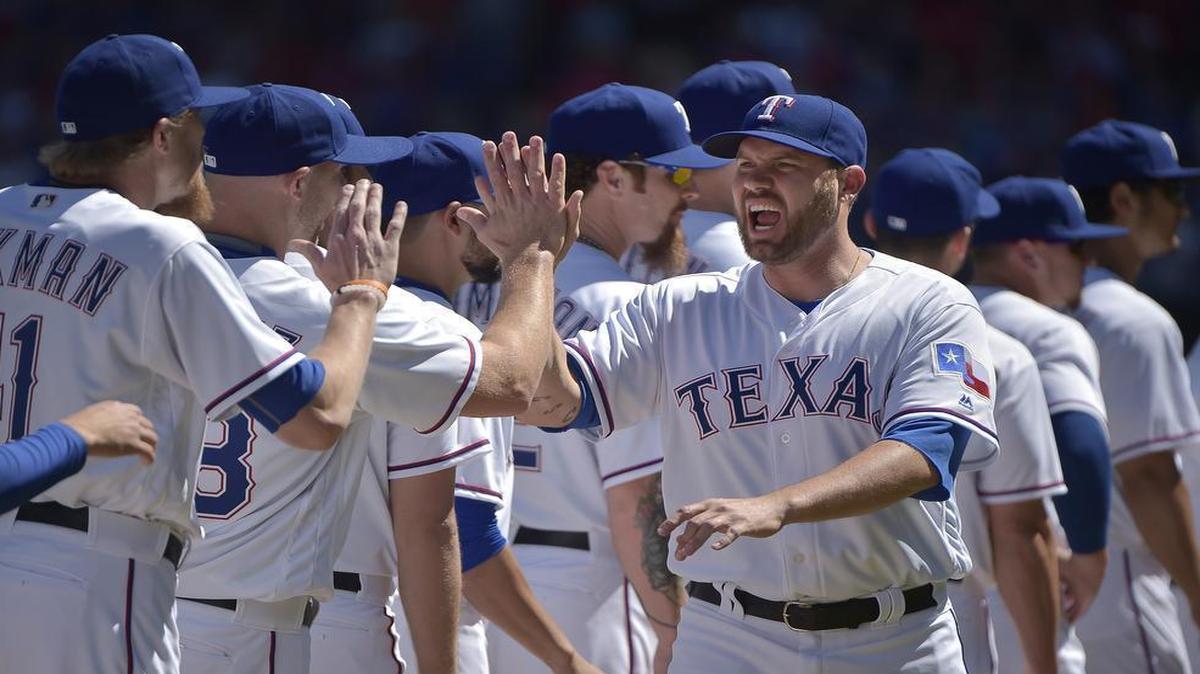 Rangers starting pitcher Colby Lewis was introduced before Monday’s Opening Day game at Globe Life Park. Lewis starts the series finale against the Mariners at 1:05 p.m. Wednesday.