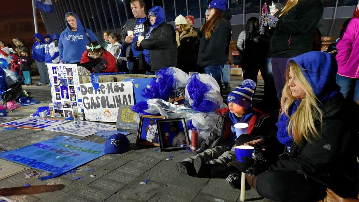Amanda Ceding and her son Peyton, 5, from Kansas City, join other fans in attending a candlelight memorial outside Kauffman Stadium in Kansas City, Mo, on Sunday, in memory of Royals pitcher Yordano Ventura, who died in a car accident in the Dominican Republic.