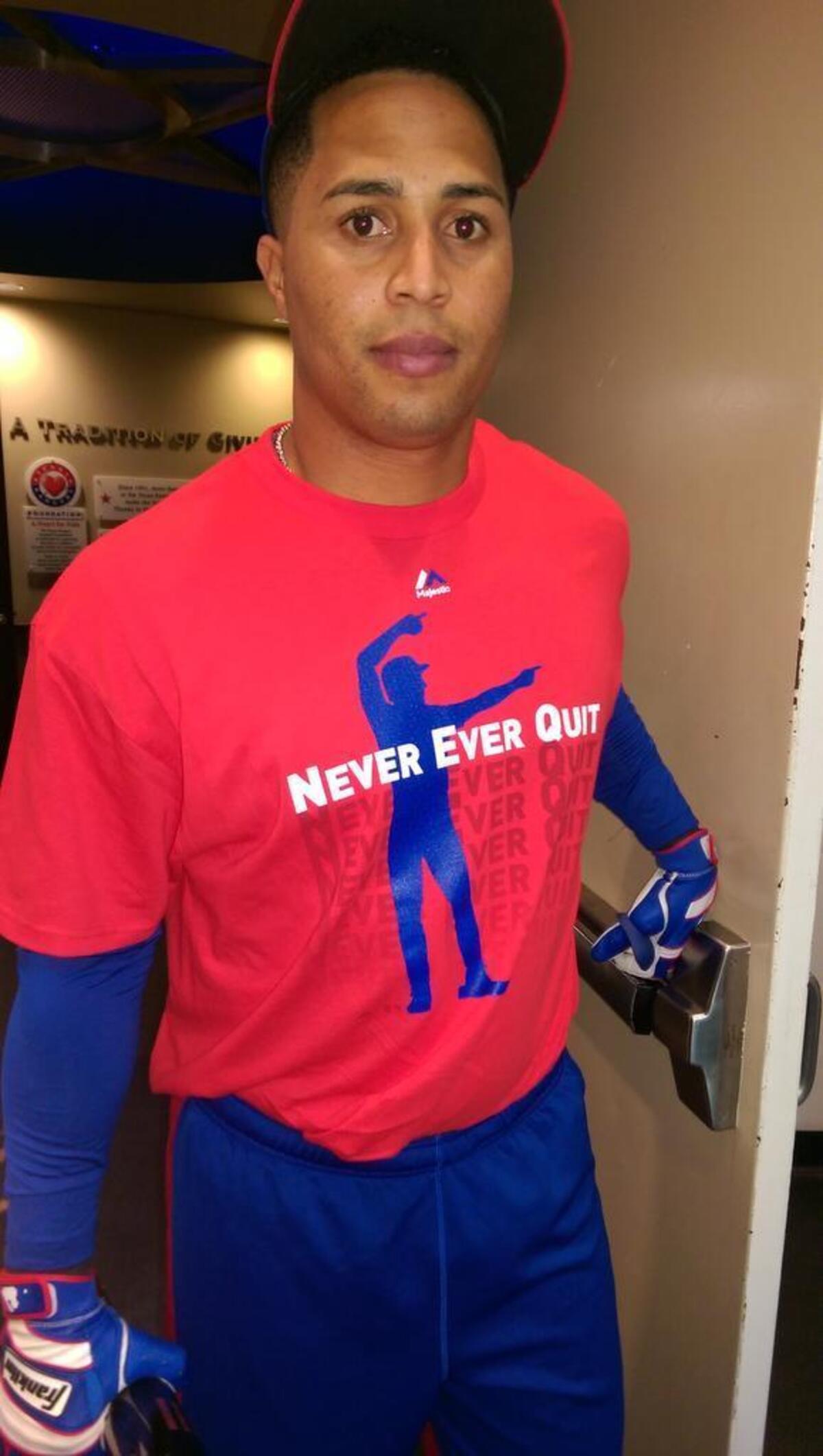 Rangers outfielder Leonys Martin wearing the Never Ever Quit workout t-shirt inspired Shawn Tolleson and the bullpen.