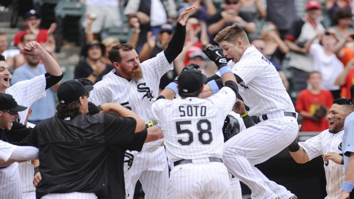 
White Sox's third baseman Gordon Beckham, second from right, celebrates with teammates Adam LaRoche, fourth from right, and catcher Geovany Soto (58) after hitting a walkoff home run in the eleventh inning to defeat the Rangers 3-2 Sunday afternoon at U.S. Cellular Field.

