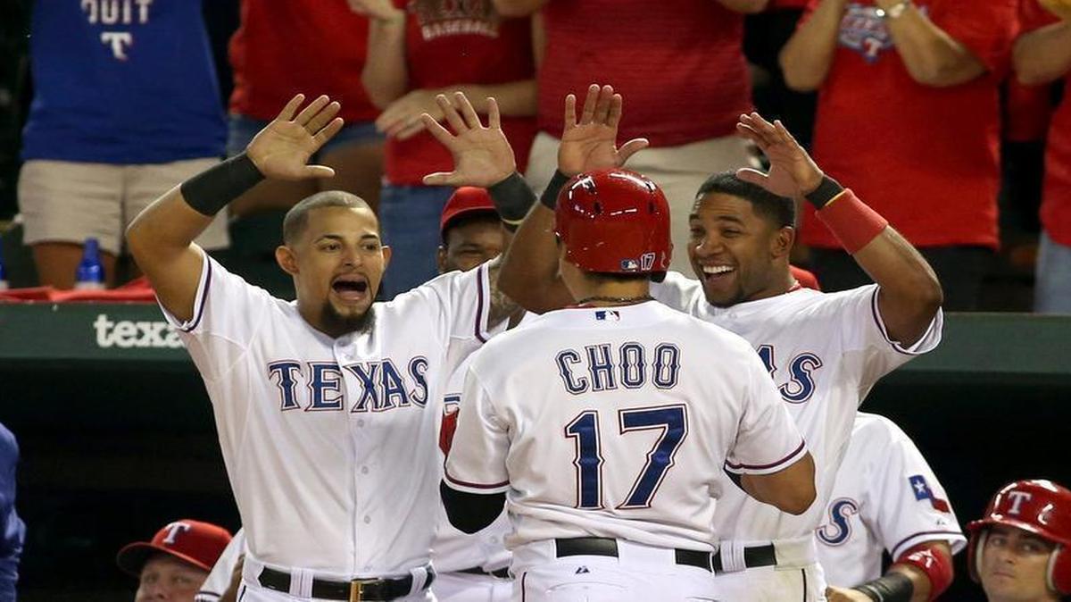 
Rangers Rougned Odor, left, and Elvis Andrus greet Shin-Soo Choo at the dugout to celebrate his home run in the fourth inning at Globe Life Park Friday. The Angels beat the Rangers 2-1.
