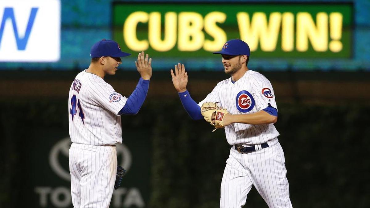 Chicago Cubs’ All-Star infielders Anthony Rizzo, left, and Kris Bryant celebrate one of the team’s 53 first-half victories this season.