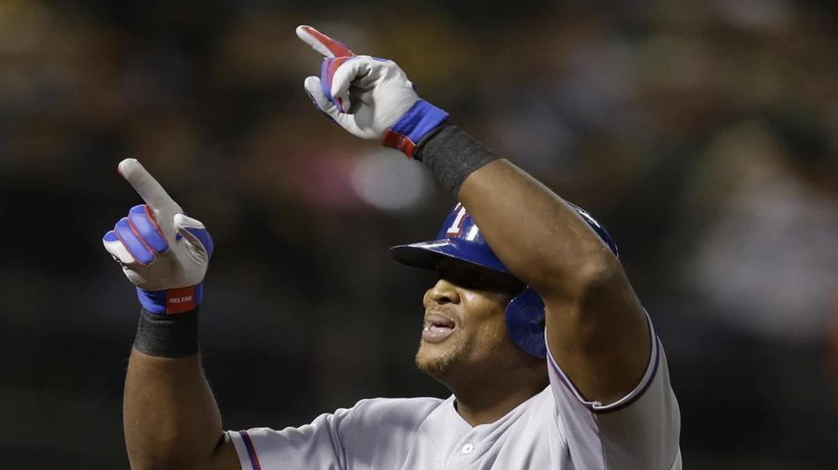 Texas Rangers’ Adrian Beltre celebrates after hitting a two-run home run against the Oakland Athletics.
