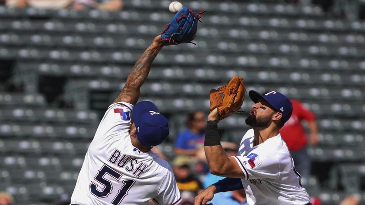 Rangers relief pitcher Matt Bush, left, injured his right knee last week in a collision with third baseman Joey Gallo.