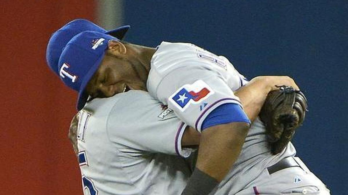 
Mike Napoli hoists Hanser Alberto following the Rangers’ 6-4 Game 2 victory. Alberto had the winning hit in the 14th inning.
