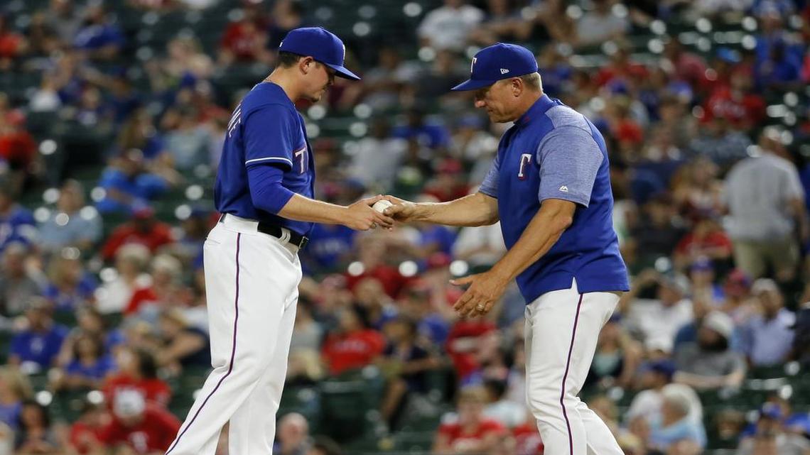 Rangers relief pitcher Nick Gardewine turns the ball over to manager Jeff Banister during a game Thursday at Globe Life Park. Injuries helped wreck the Rangers’ bullpen as the season wore along in 2017 and meant untested players had to fill key roles down the stretch.