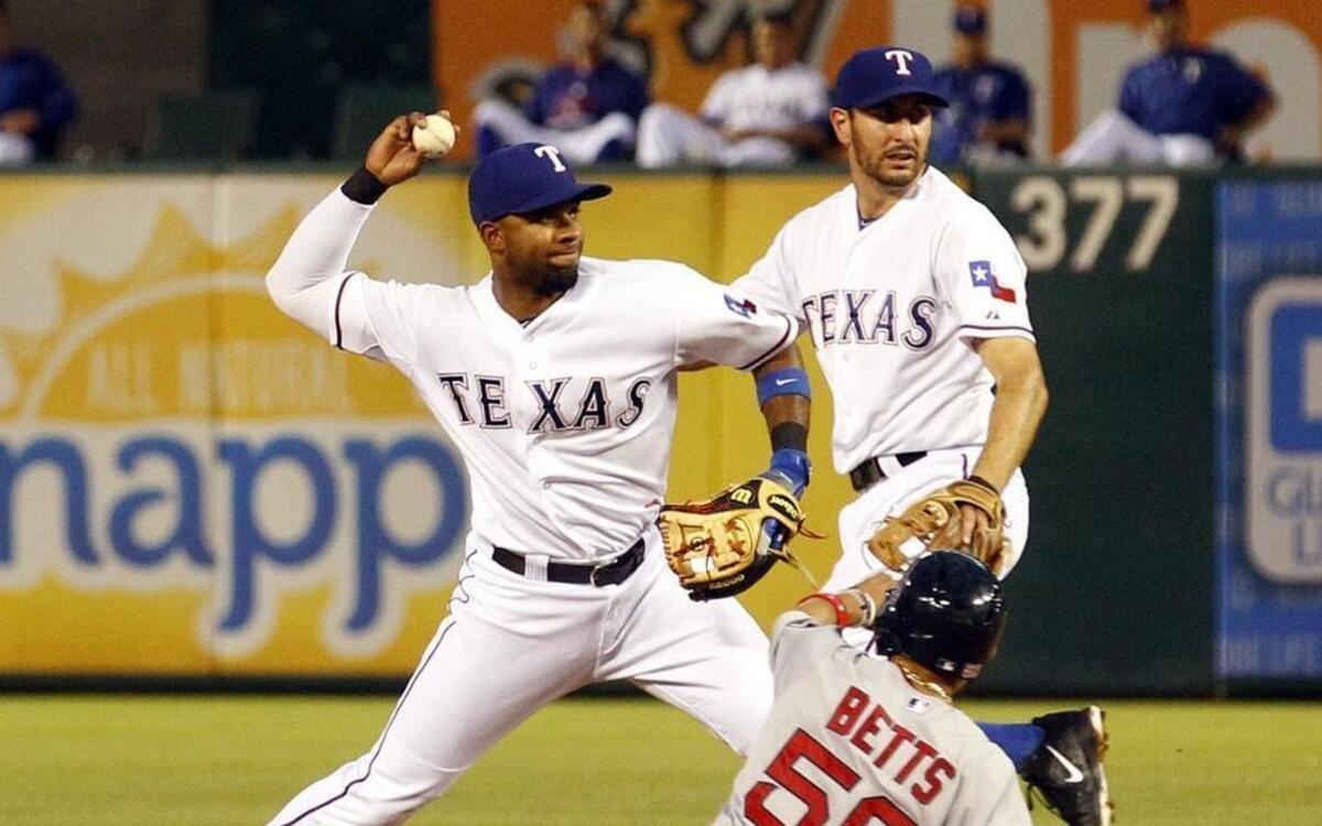 
Rangers shortstop Elvis Andrus, left, has improved his defense after a rough start. He has only one error in his past 15 games before Sunday after committing five in April and six in May.
