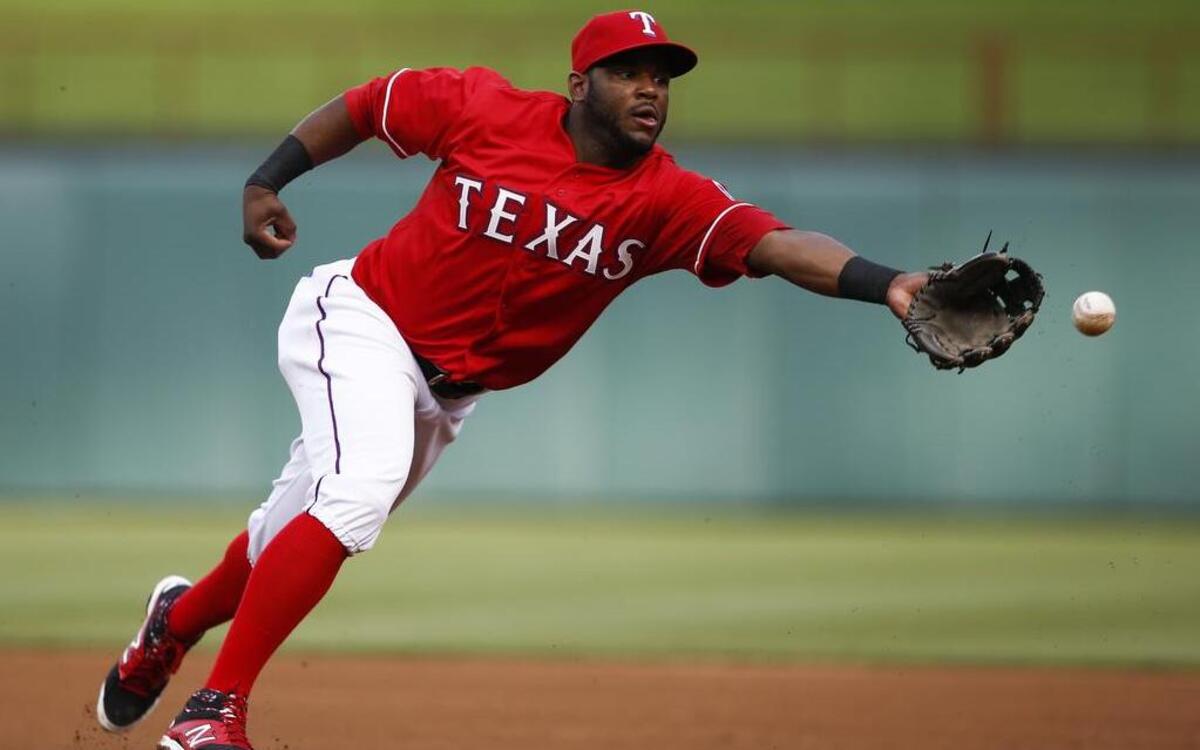 
Rangers infielder Hanser Alberto makes a smooth flip for an out at first on Saturday night.

