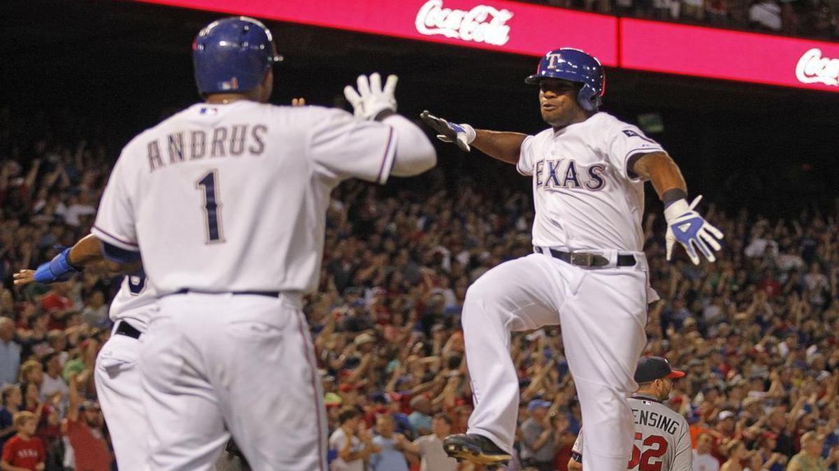 
Rangers left fielder Delino DeShields, right, scored the second run on Mitch Moreland’s two-run drive to center field in the eighth to give Texas a 4-2 lead. The Rangers beat the Twins 6-2 Friday night at Globe Life Park.

