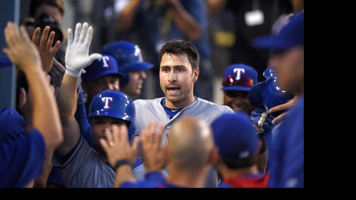 
Joey Gallo receives high-fives after his two-run homer off Clayton Kershaw in the third inning.

