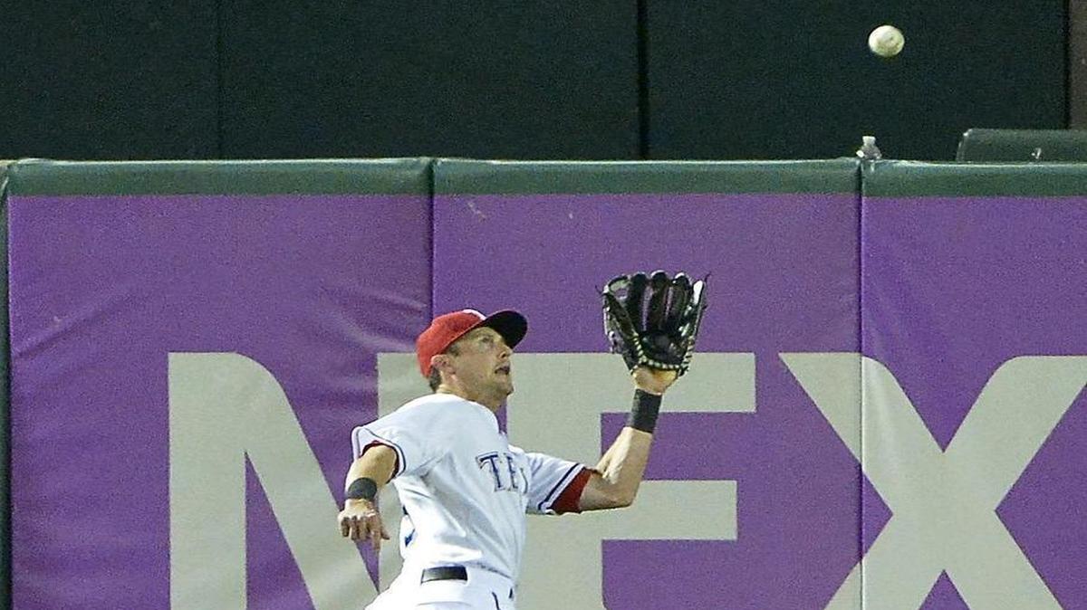 Rangers center fielder Drew Stubbs, a late-inning defensive replacement, makes a running catch for the final out against the Tigers at Globe Life Park on Sept. 29