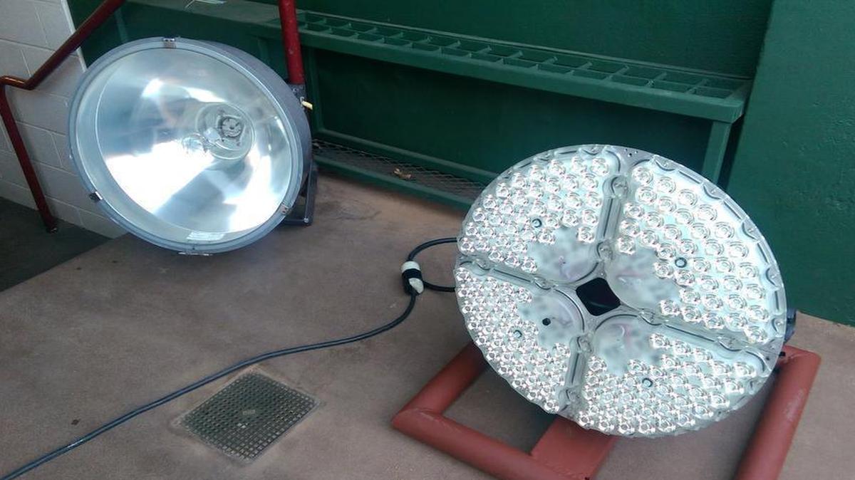 The new LED light fixtures, right, will replace the old metal bulb-based lights, left, at Globe Life Park. The upgrade is expected to be ready by early March.